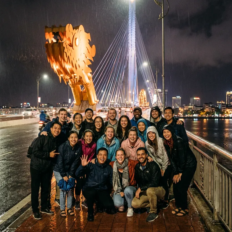 Cheerful Agency Trip of 17 People at Danang Bridge in the Rain Cheerful Agency Trip of 17 People at Danang Bridge in the Rain