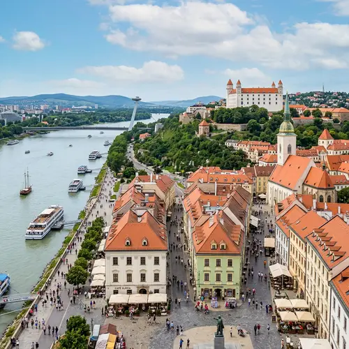 Bratislava Castle Overlooking Colorful Cityscape | Danube River Scene