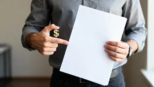 Man Showcasing A4 Document with Money Gesture