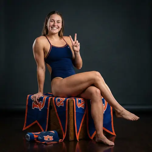 Confident Female Swimmer Studio Portrait