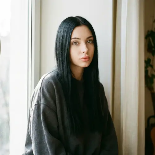 Caucasian Girl with Long Black Hair in Oversized Sweatshirt