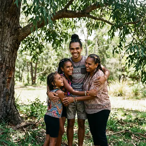 Indigenous Siblings Embrace Under a Tree