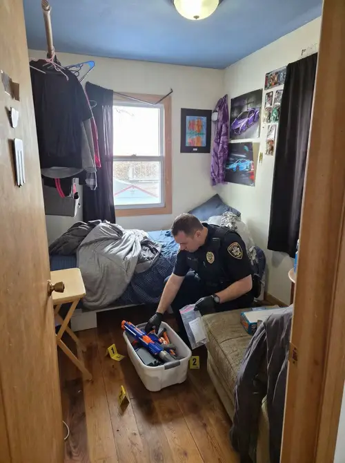 Police Officer Searching a Room