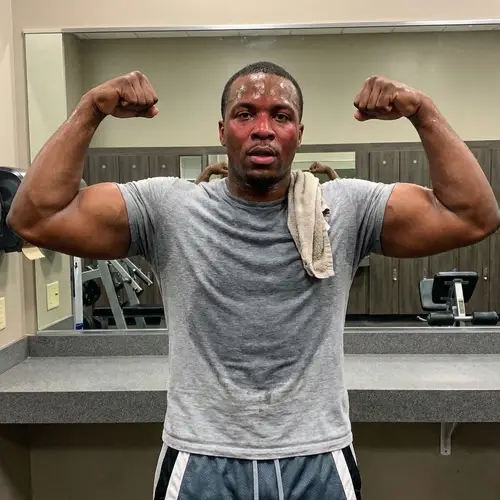 Muscular Black Man Poses After Intense Workout