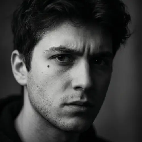 Dramatic Black and White Portrait of Young Man with Intense Focus