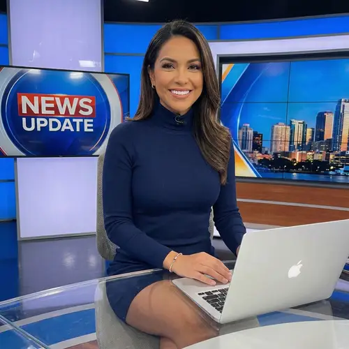Empowering Latina News Anchor in Stylish Minidress