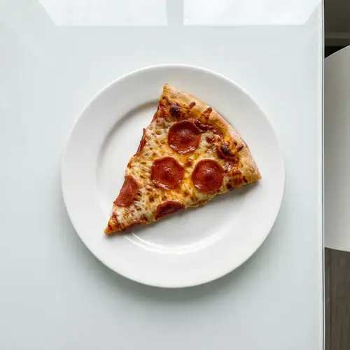 Delicious Cheese & Pepperoni Pizza Slice Photo