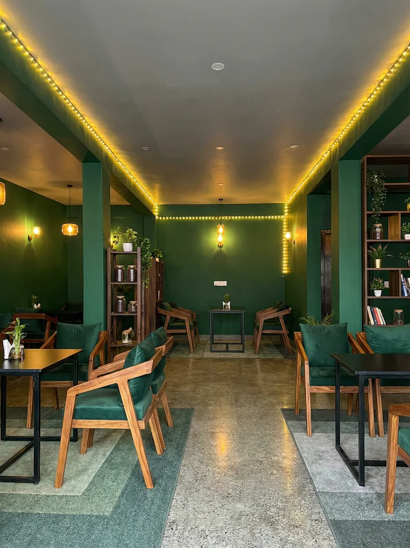 Dark Green Cafe Design with Warm Yellow Lights