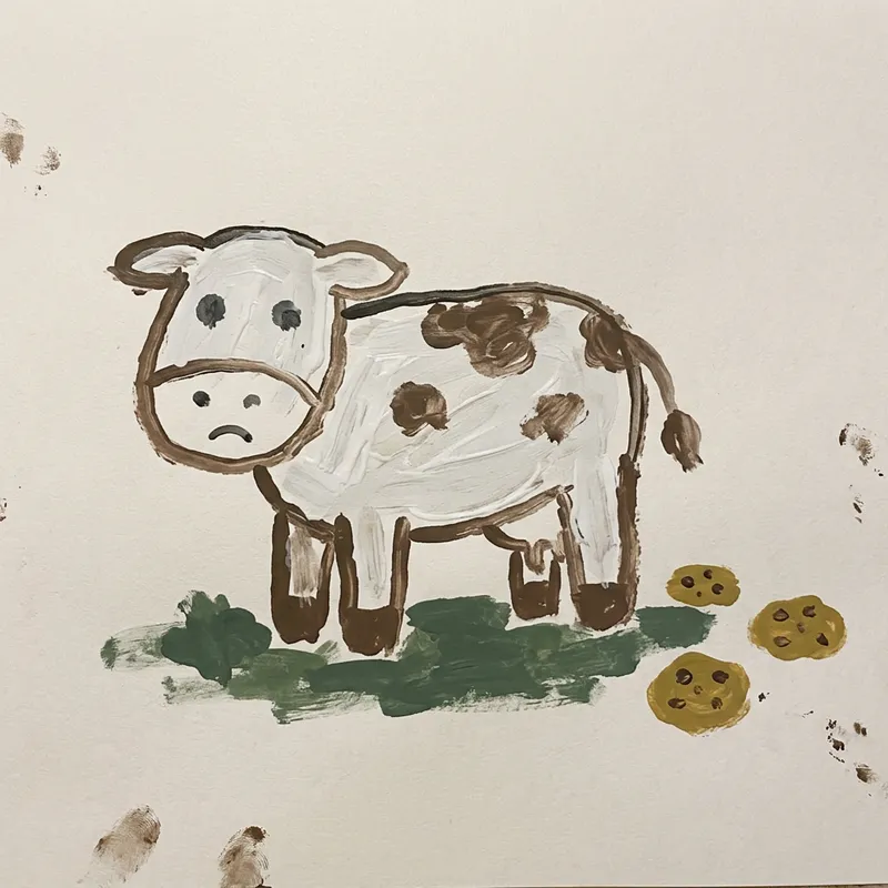 Child's Simple Drawing of a Cow and Cookies