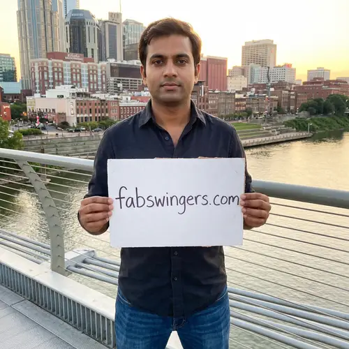 South Asian Man Holding Sign for Fabswingers.com