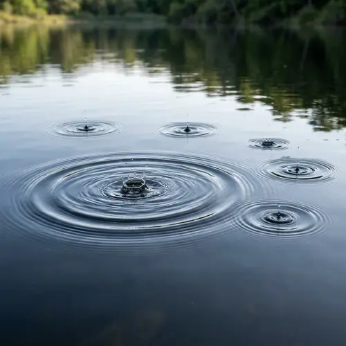 Water Droplets Creating Ripples with One Standing Out