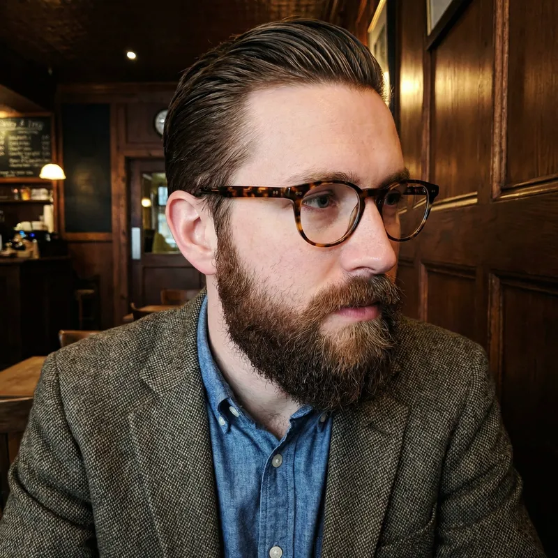 Stylish Man with Glasses and Brown Beard