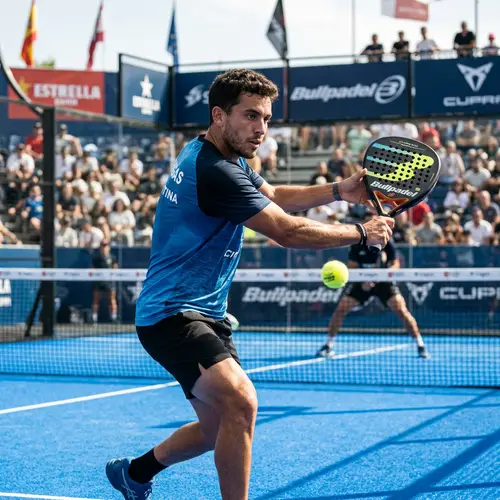 Skilled Hispanic Padel Player in Competitive Action