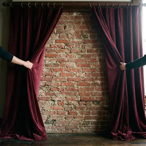 Revealing a Surprise: Opening Plush Velvet Curtains to a Brick Wall