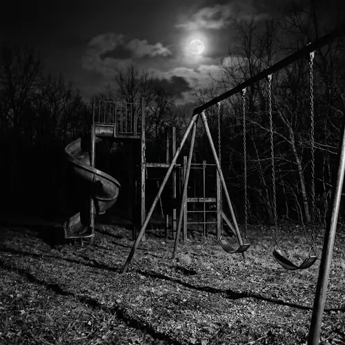 Spooky Night Playground: Moonlit Haunted Scene with Swings and Slide
