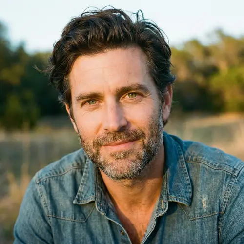 43-Year-Old Man with Dark Hair and Green Eyes