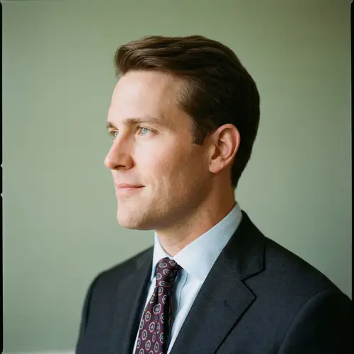 Profile Portrait of a Man in a Dark Suit