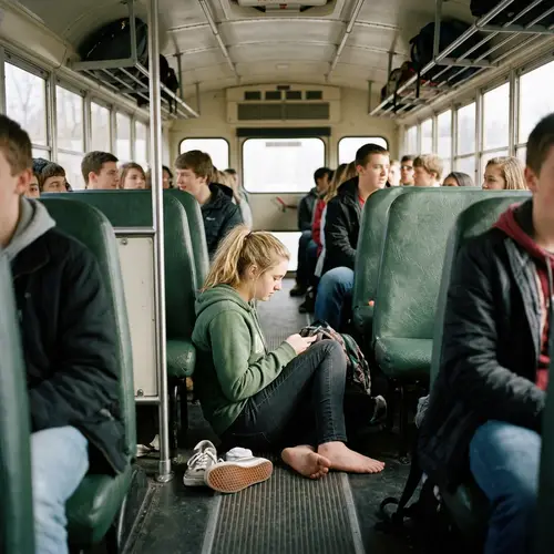 Blonde Student Shows Bare Feet on School Bus