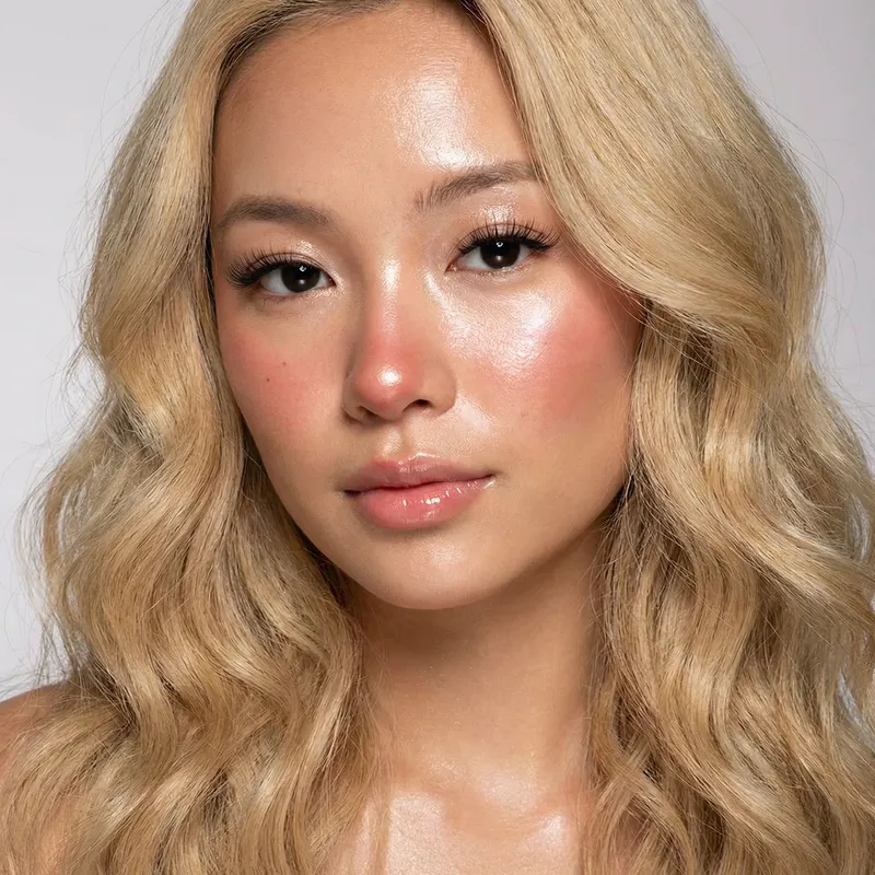 Blonde Woman with Black Eyes | Glossy Features | Sleek Blonde Hair