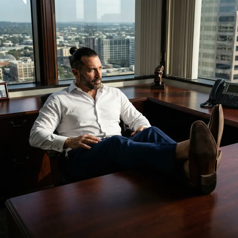 Confident Italian Entrepreneur with Striking Blue Eyes | Luxury Office Portrait