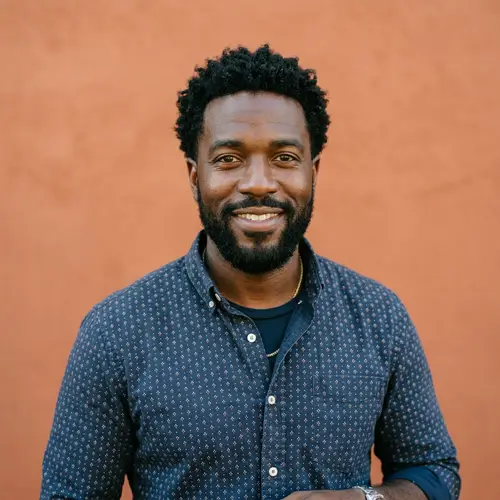 Warm Portrait of a Black Man in Casual Attire