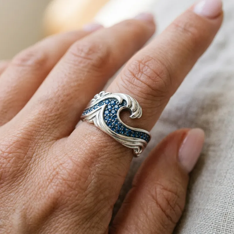 Elegant Silver Ring with Blue Sapphires and Wave Design