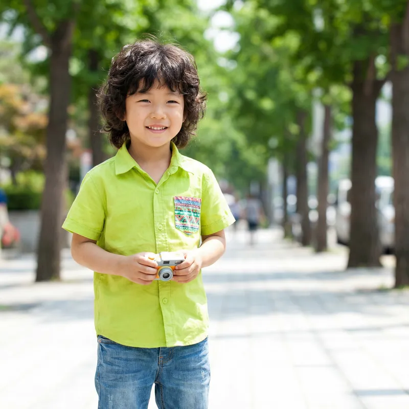 Charming South Korean Boy in Green Shirt