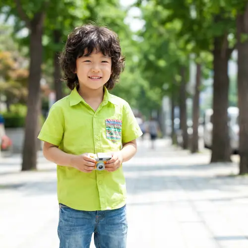 Charming South Korean Boy in Green Shirt