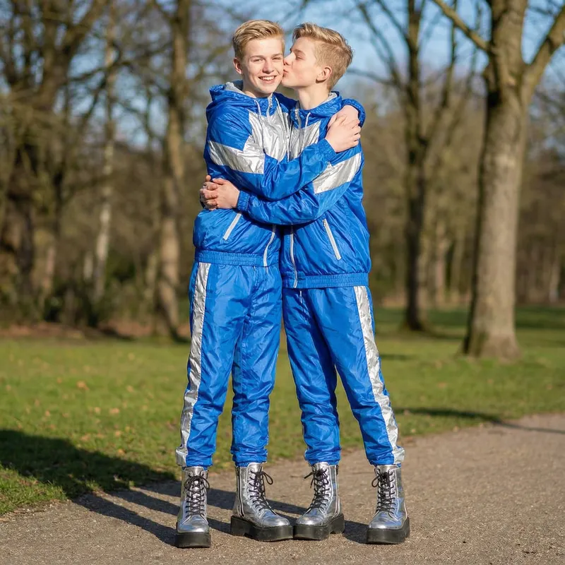 Happy Blonde Boys in Shiny Tracksuits and Platform Boots