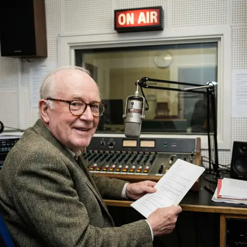 Elderly Radio Broadcaster with No Beard and Glasses