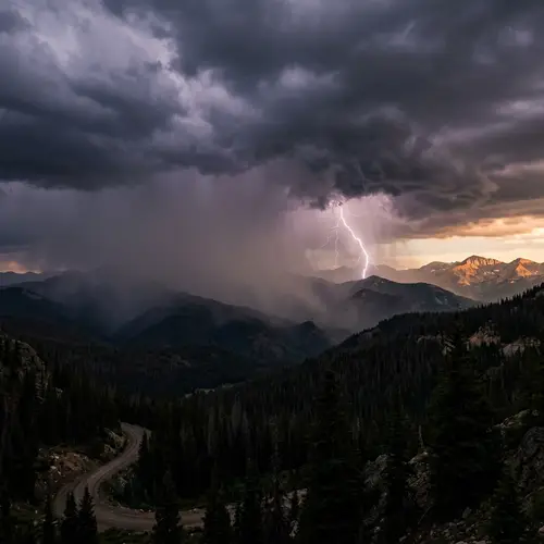 Intense Landscape Scene: Thunderstorm Brewing Over Forest Mountain Range