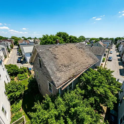 Weather-Beaten Roof in Town: A Drone's View