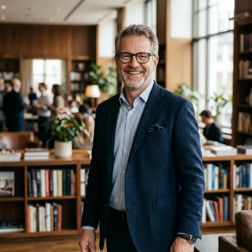 Happy Middle-Aged Man in Blazer with Glasses