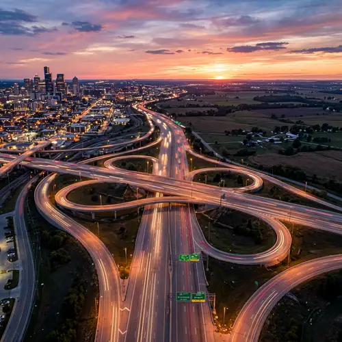 Scenic Sunset Over Urban Highway System | Tranquil Cityscape