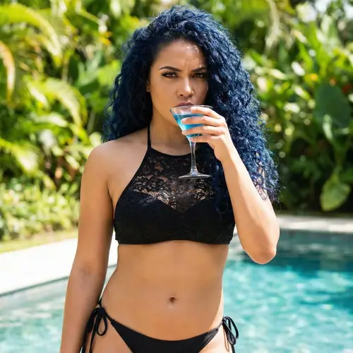 Glamorous Woman with Dark Blue Hair by the Pool