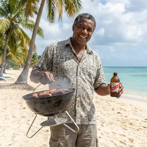 Caribbean BBQ Experience: Man with Grill & Beer