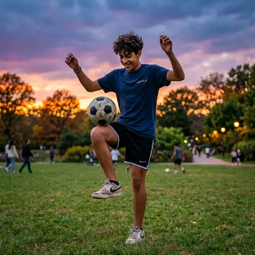 Middle-Eastern Teenager Playing Soccer at Dusk in the Park