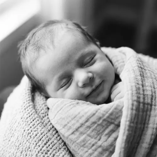 Adorable Newborn Baby Wrapped in Soft Fabric Blanket