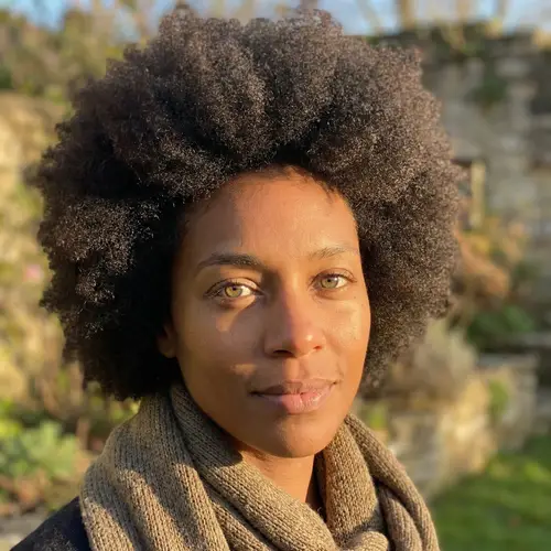 Captivating Dark-Skinned Woman with Enchanting Hazel Green Eyes