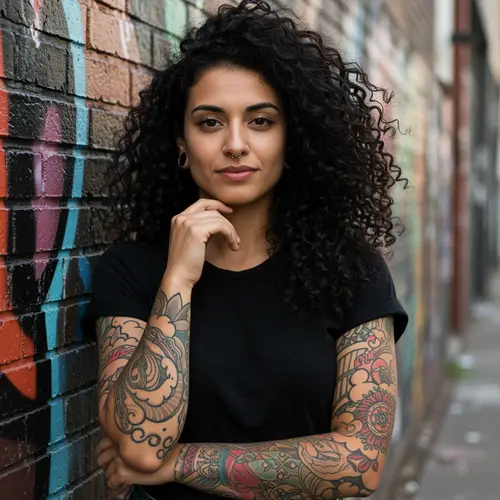 Dark Curly Hair Woman with Tattoos and Piercing