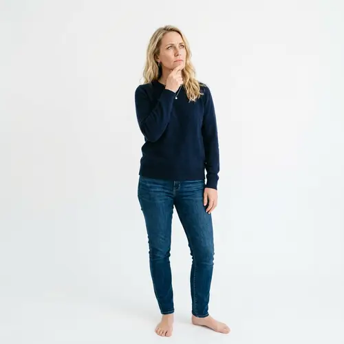 Thoughtful 40-Year-Old Woman in Casual Attire