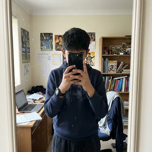 Intriguing Self-Portrait: 14-Year-Old South Asian Boy Taking iPhone Mirror Selfie