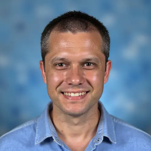 Classic 90s Yearbook Photo of Smiling Student