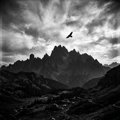Majestic Mountain Silhouette in Monochrome with Bird in Flight