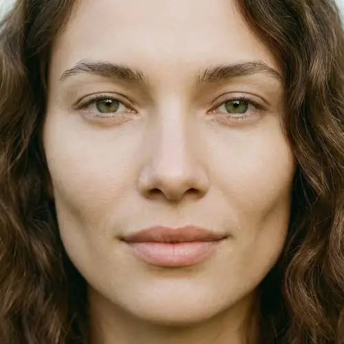 Serene Human Face with Almond-Shaped Eyes and Distinctive Cheekbones