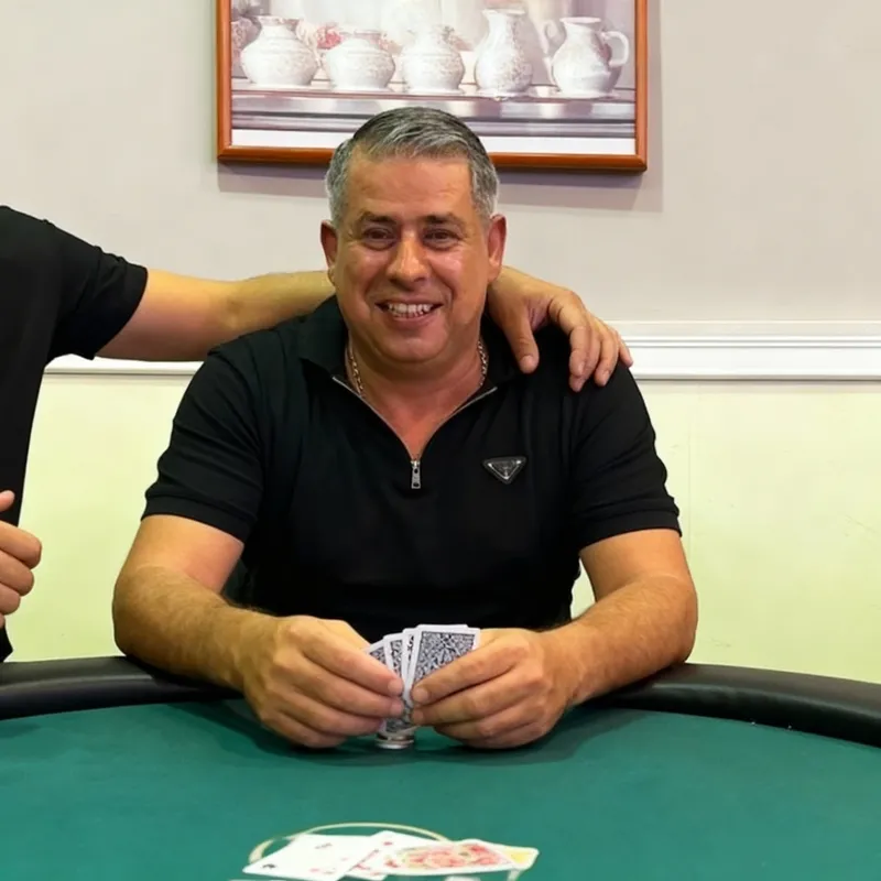 Poker Player with Cards at the Table