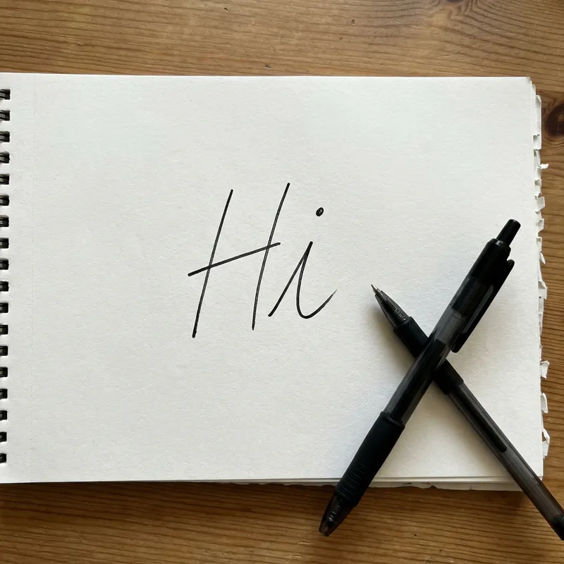 Handwritten 'Hi' Salutation on Paper