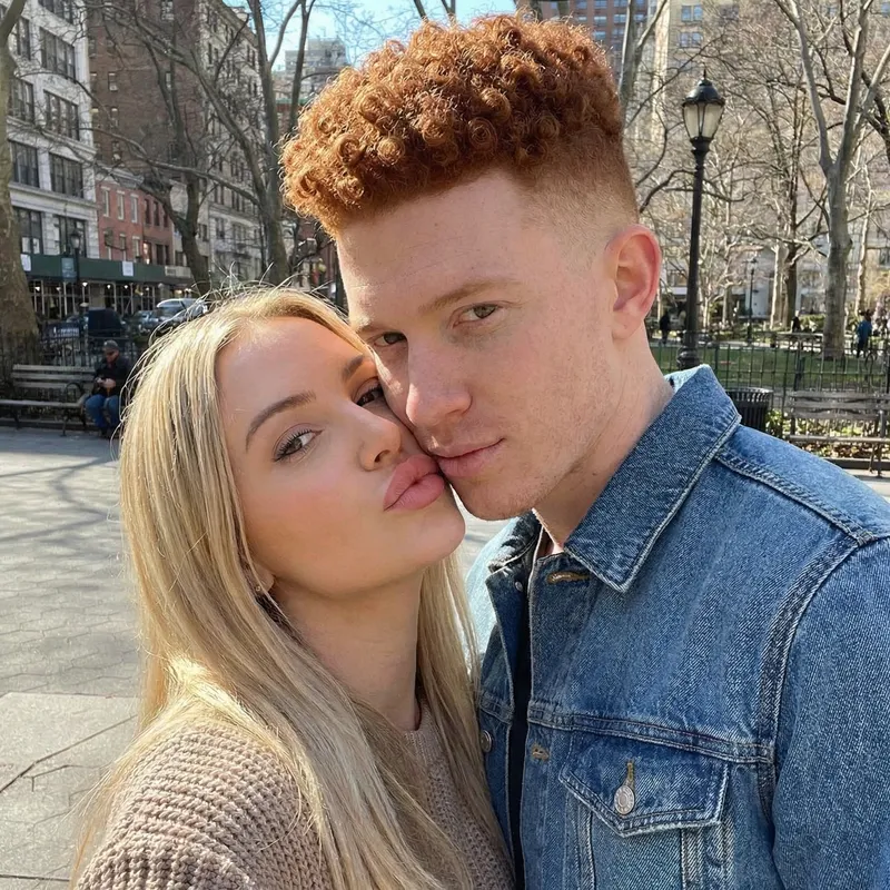 Blonde Woman Kissing Redheaded Man - Romantic Moment Blonde Woman Kissing Redheaded Man - Romantic Moment