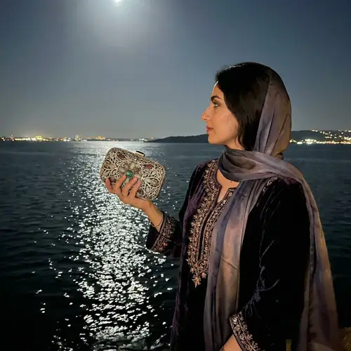 Luxurious Middle-Eastern Woman by the Shimmering Sea