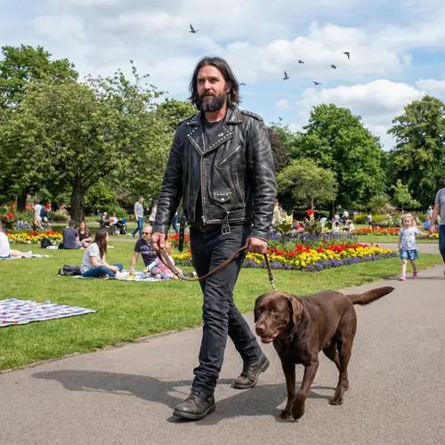 Rocking the Park: Man with Labrador Dog
